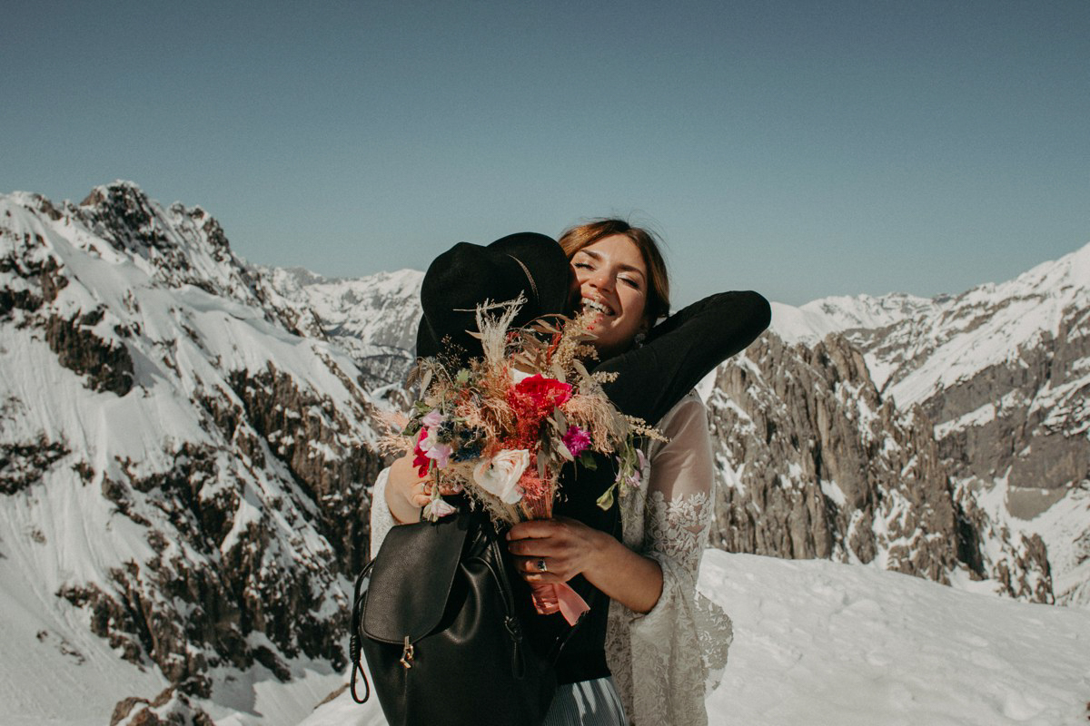 Snowboarder mountain wedding