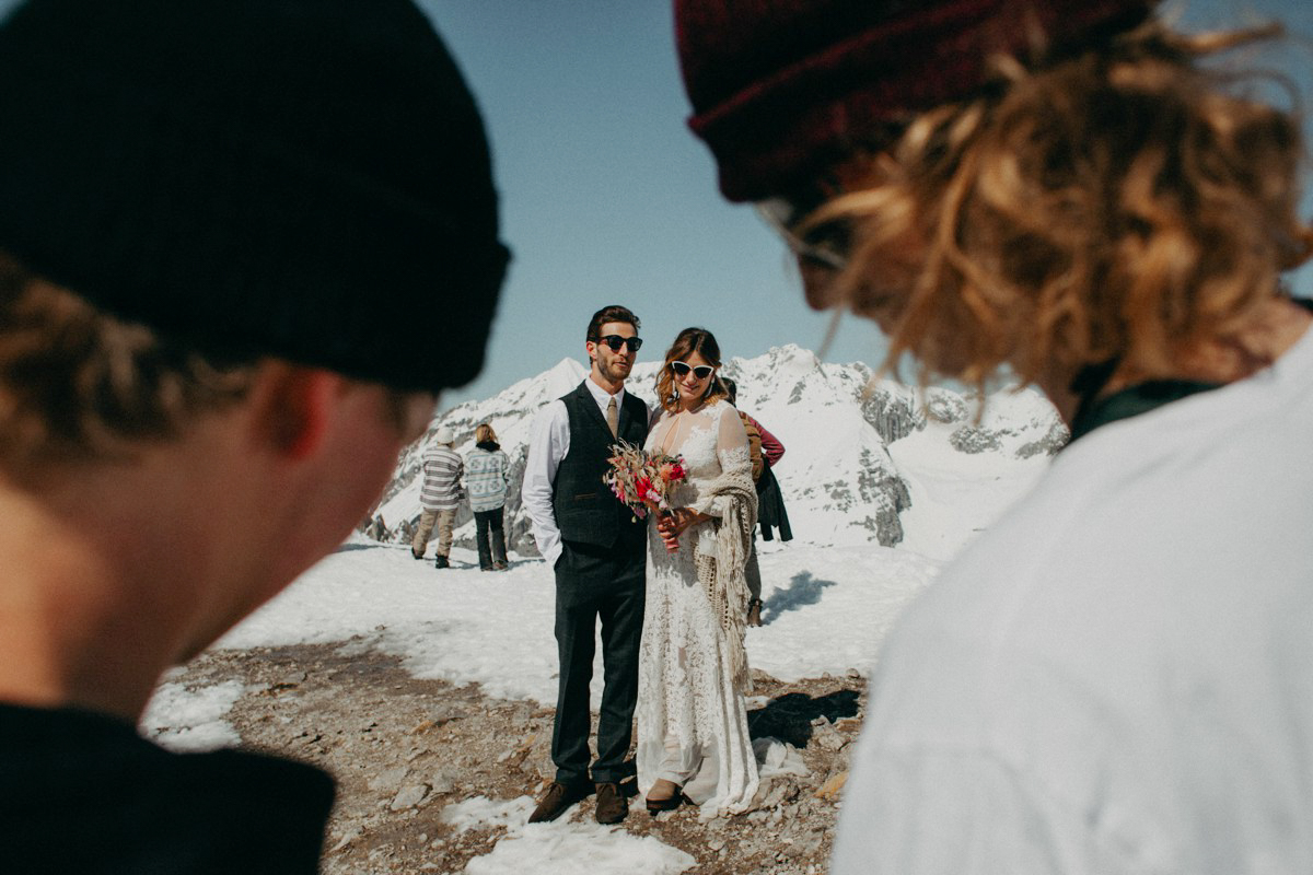 Snowboarder mountain wedding